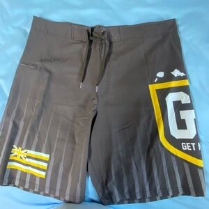Men’s brown and yellow Hawaiian flag swim shorts
